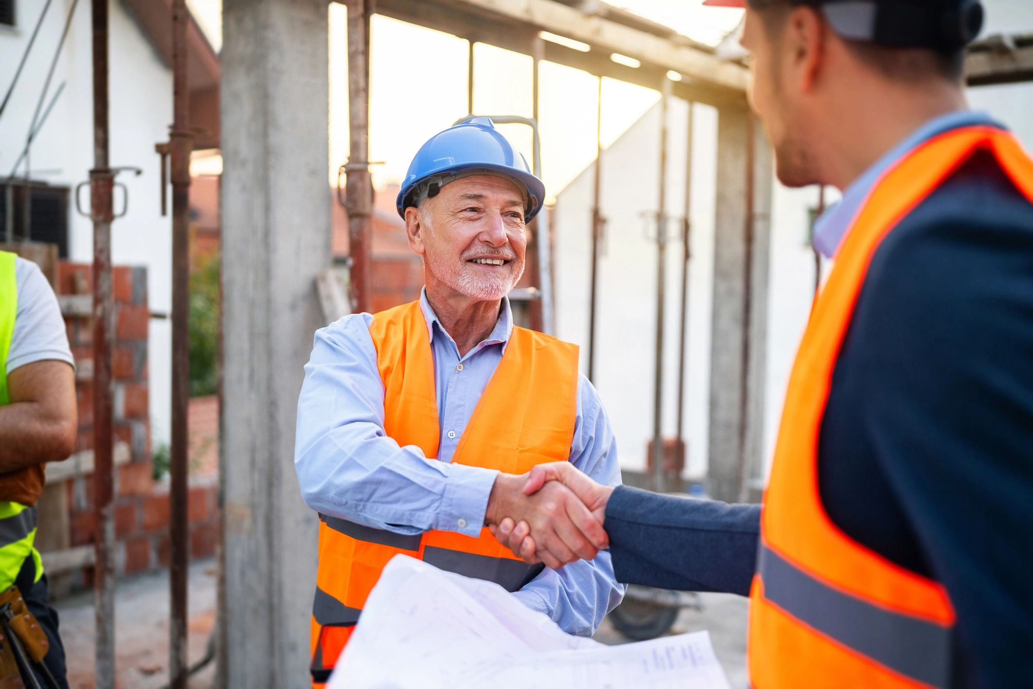 Construction team reviewing plans and coordinating on site